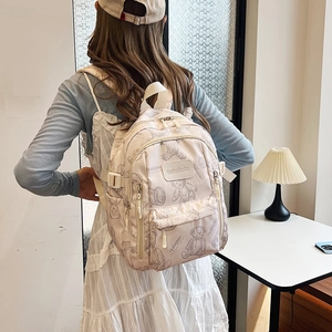 Cream large capacity casual backpack for students featuring cute bear patterns and prints