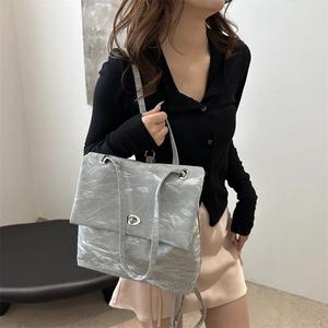 Minimalist silver pleated shoulder bag for women with metallic texture and swivel lock