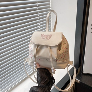Mini white backpack for women with pink floral pattern and butterfly embroidery