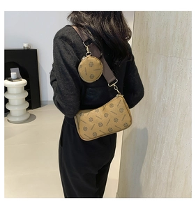 Detail of a brown retro 2-in-1 crossbody bag with coin purse and monogram print