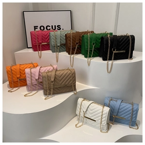 Detailed close-up of V-quilted faux leather crossbody bags in ten vibrant colors
