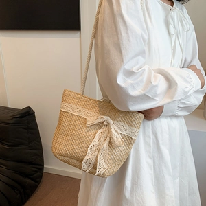 Large capacity woven straw tote bag with elegant white lace bow and shoulder strap