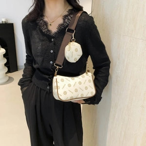 Chic two-piece crossbody bag and round coin purse with retro floral patterns