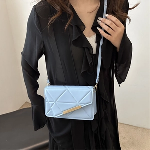 Chic light blue crossbody square bag with geometric stitching and gold buckle detail