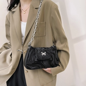 Black glossy crescent shoulder bag with silver butterfly buckle and double chain strap