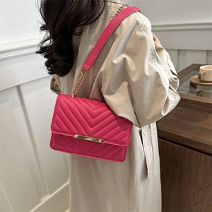 Chic rose red crossbody bag with V-quilted pattern and elegant gold chain strap