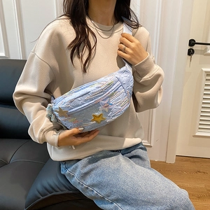 Chic light blue crossbody chest bag with star embroidery and embossed letter texture