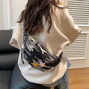 Black quilted chest bag for women with colorful star patches and woven drawstring