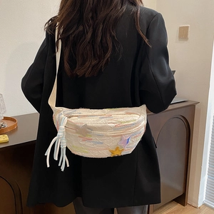 Quilted off-white crossbody chest bag with colorful star details and braided tassel charm