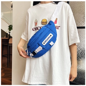 Detailed side view of blue nylon chest bag with WOAINI label and adjustable strap