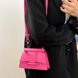Minimalist bright pink leather crossbody square bag with stylish circular buckle detail