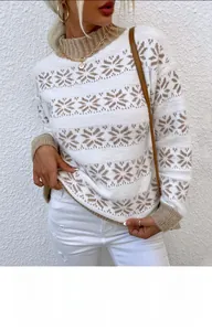 Detail of winter knit sweater featuring brown snowflake jacquard and ribbed oatmeal cuffs