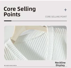 Close-up of a white chunky knit cardigan with a V-neckline on a wooden hanger