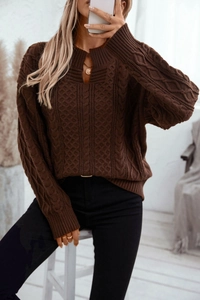 Close-up of deep brown cable-knit sweater featuring a unique V-cut collar design