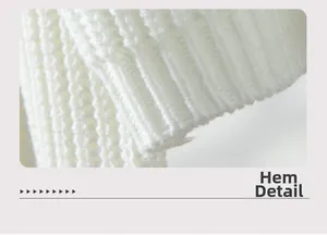 Detailed close-up showing the ribbed knit hem and thick white fabric texture