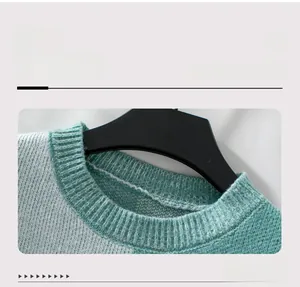 Detail view of the green and white contrast plaid pattern on the knit sweater collar