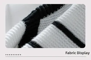 Close-up of black and white striped knit fabric showing thick texture and soft fibers