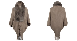 Detail view of khaki knitted poncho featuring a plush faux fur collar and long fringe hem