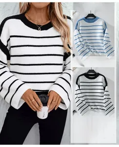 Detail showing loose-fit knit sweaters with classic black and blue horizontal stripes