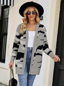 Outdoor shot of long-sleeved camouflage knit cardigan with ribbed cuffs and open front