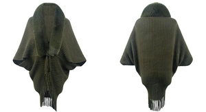 Detail of dark green knit shawl featuring faux fur collar and long tassel hemline
