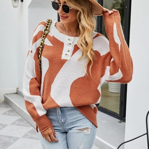 Maglione da donna in maglia arancione brillante e bianco a blocchi con bottoni retrò