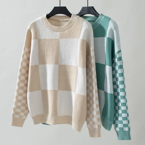 Detailed knit texture of checkerboard pattern crewneck sweater in cream and green