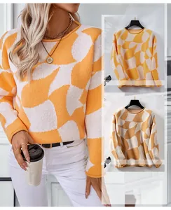 Detail view showing colorblock knit texture and rolled cuffs of casual pullover sweater