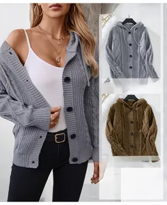Detail of cable knit pattern and hooded drawstring on long sleeve knitted cardigan
