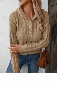 Detail of cable knit camel hoodie featuring classic buttoned collar and soft texture