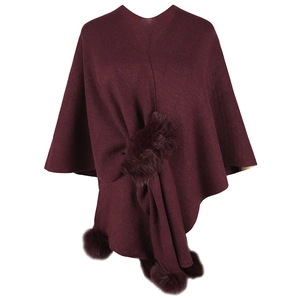 Women's knit poncho sweater in burgundy with decorative faux fur pom-poms and V-neck