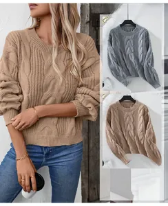 Detail view of khaki and grey cable knit sweaters with classic crew neck and ribbed cuffs
