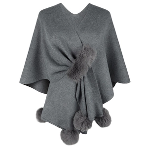 Dark grey knitted poncho with fur collar and pompom details for women's winter wear