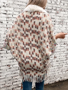 Women's boho knit shawl cardigan with faux fur collar and tassels in beige pattern