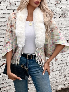 Women's knit poncho sweater with faux fur collar and vibrant colorful geometric patterns
