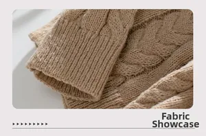 Detailed macro view of camel cable knit texture and ribbed cuff on a hooded sweater