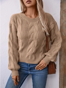 Classic khaki cable knit sweater with chunky twist pattern and relaxed crewneck fit