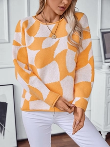 Detail of color-block knit sweater featuring yellow and white geometric patchwork texture