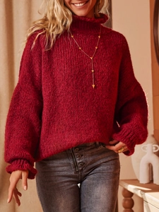 Red chunky knit turtleneck sweater with a relaxed loose fit and drop shoulders