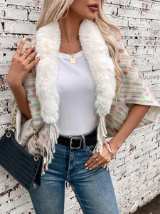 Fashionable knit poncho sweater with faux fur collar and pastel plaid pattern