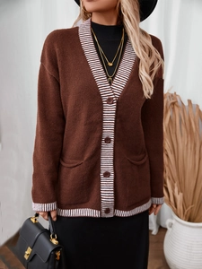 Detail of V-neck striped knit cardigan with button-down front and large front pockets