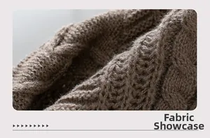 Macro view of dark brown cable knit fabric on a thick winter cardigan sweater