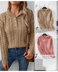 Detail of cable knit hooded sweater showing texture and wooden buttons in khaki and pink