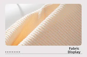 Detailed macro view of soft cream knit fabric showing high-quality texture and weave
