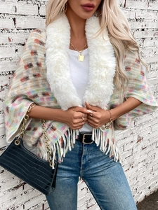 Fashionable plaid knit poncho sweater with faux fur collar and fringe hem detail