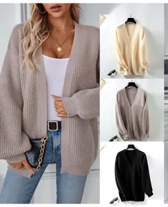 Detail view of ribbed knit texture and vertical stripes on long sleeve loose cardigan