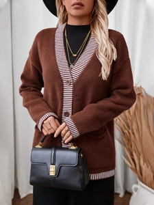 Women's oversized brown knit cardigan with striped trim and single-breasted buttons