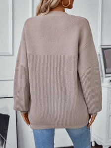 Oversized beige knitted sweater for women with ribbed cuffs and drop shoulder style
