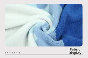 Detailed view of soft color-block knit fabric texture in blue and white colors