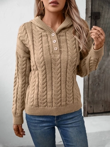 Close-up of khaki cable-knit hoodie featuring vintage buttons and textured stitch detail